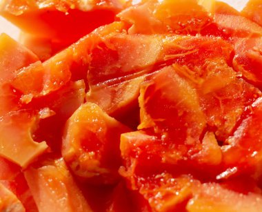 Arkaplan olarak olgun papaya parçaları