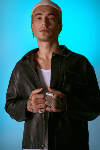 A stylish young man poses confidently in a chic jacket and fun accessories.