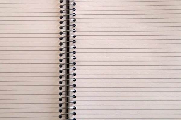 Office supplies. An open ring notebook.