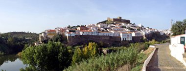 Mertola, village of Portugal and its castle. Village in the south of Portugal in the region of Alentejo. clipart