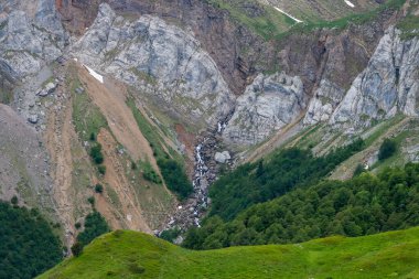 Geomorphological rock folds on the north side of the Pyrenees, French Pyrenees (Borce, France; 15 06 2016). Rocky landscape next to the small glacial lake of Astanese that appears with the thaw.