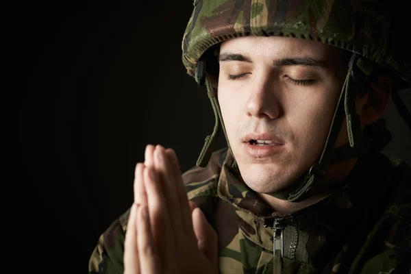 Studio Portrait Of Soldier In Uniform Praying — Stock Photo, Image