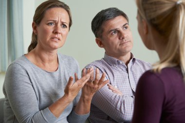 Couple Discussing Problems With Relationship Counsellor clipart