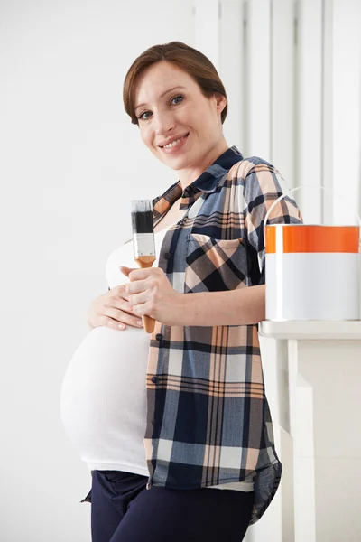 Pregnant Woman Taking Break Whilst Decorating Nursery — Stock Photo, Image