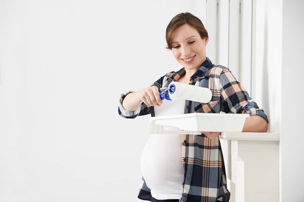 Portrait Of Pregnant Woman Decorating Nursery — Stock Photo, Image