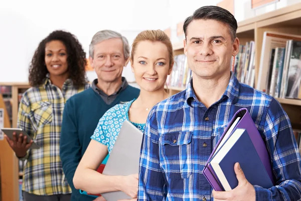 Group Of Mature Students Studying In Library — Stock Photo, Image