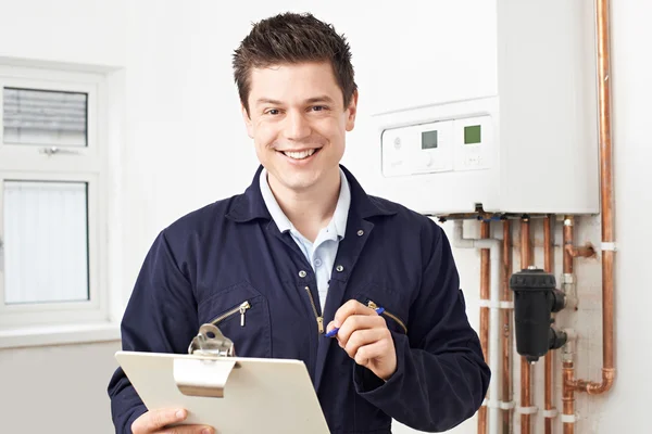 Male Plumber Working On Central Heating Boiler — Stock Photo, Image