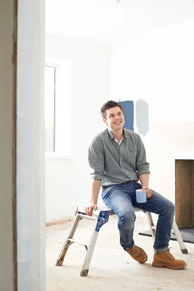 Man Sitting In Property Being Rennovated — Stock Photo, Image