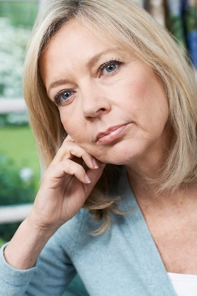 Head And Shoulders Portrait Of Thoughtful Mature Woman At Home — Stock Photo, Image