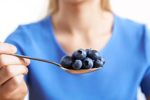 Close Up Of Woman With Spoonful Of Blueberries — Stock Photo, Image