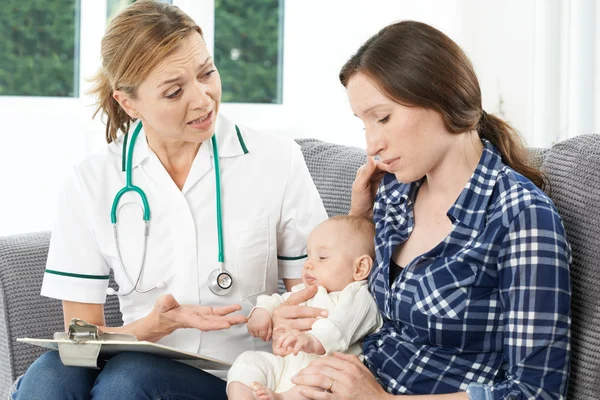 Health Visitor With New Mother Suffering With Depression Stock Picture