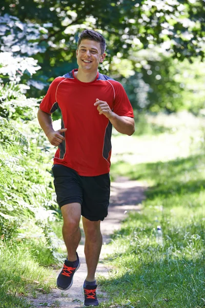 Young Man Running Outdoors In Countryside — Stock Photo, Image