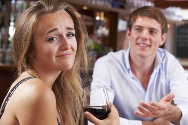 Couple On Unsuccessful Blind Date In Restaurant clipart
