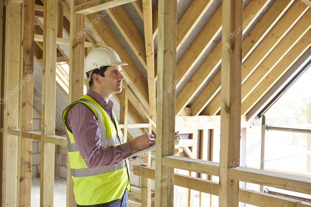 Building Inspector Looking At New Property