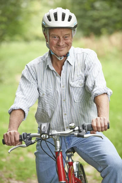 Senior Man Enjoying Cycle Ride In The Countryside — Stock Photo, Image