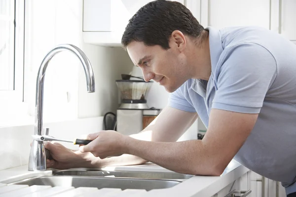 Plumber Mending Tap With Adjustable Wrench — Stock Photo, Image