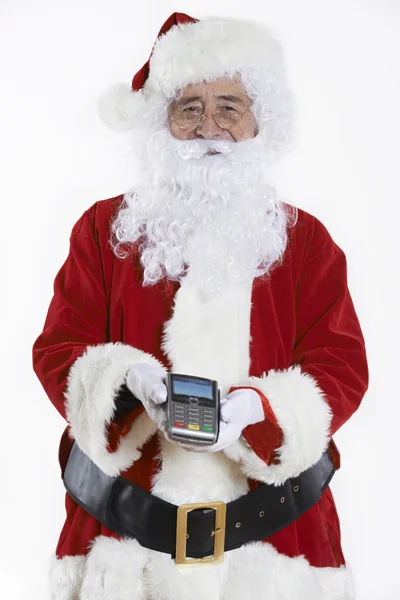 Studio Shot Of Santa Claus Holding lector de tarjetas de crédito — Foto de Stock