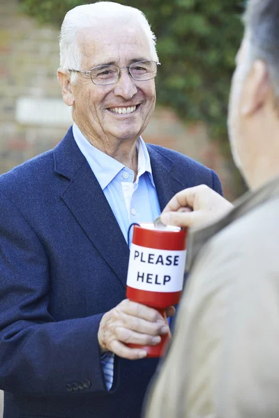 Senior Man Collecting Money For Charity — Stock Photo, Image