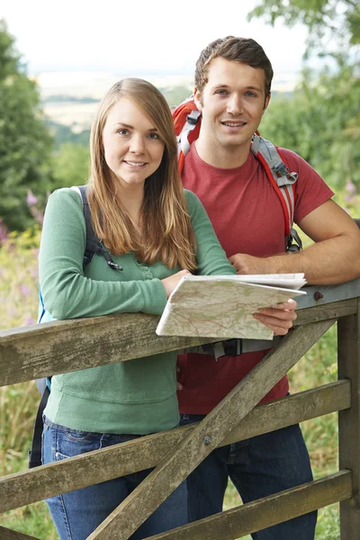 (Inggris) Portrait Of Couple On Hike In Countryside With Map — Stok Foto