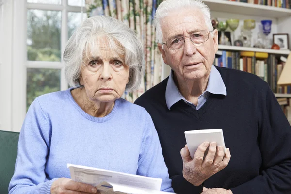 Senior Couple At Home With Bills Worried About Home Finances — Stock Photo, Image