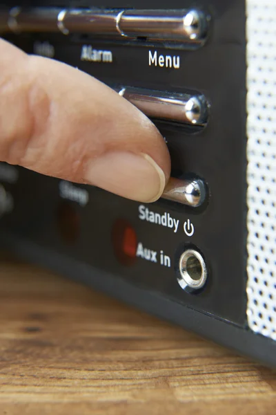 Close Up Of Woman Pressing Standby Button On Radio — Stock Photo, Image