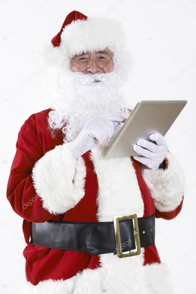 Santa Claus Using Digital Tablet On White Background