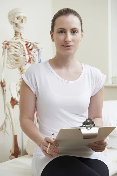 Portrait Of Female Osteopath In Consulting Room — Stock Photo, Image