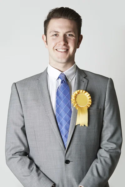 Portrait Of Politician Wearing Yellow Rosette — Stock Photo, Image