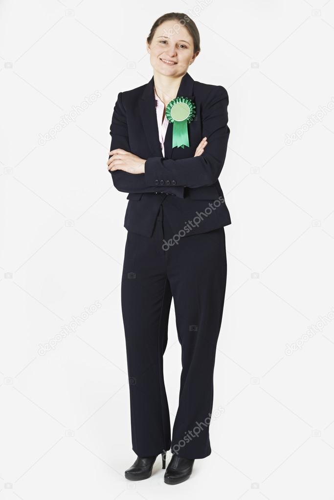 Full Length Portrait Of Female Politician Wearing Green Rosette