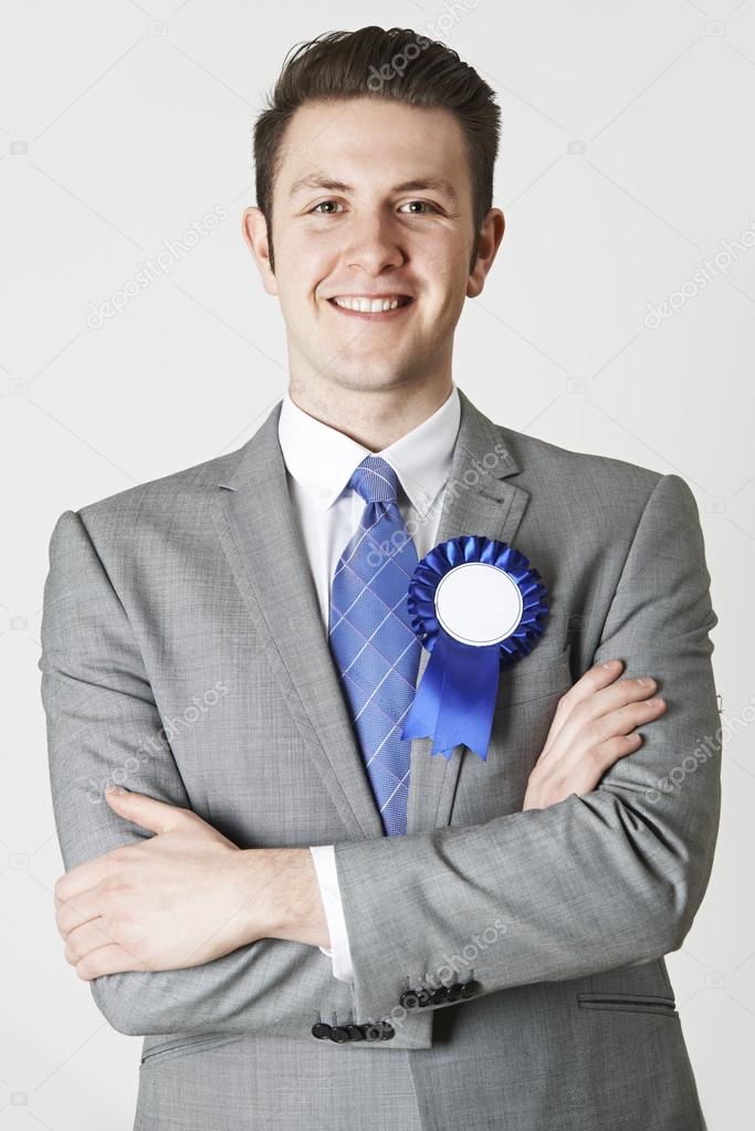 Portrait Of Politician Wearing Blue Rosette