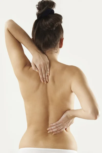 Studio girato di donna con dolore alla schiena — Foto Stock