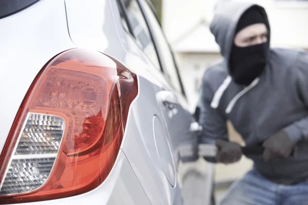 Masked Man Breaking Into Car With Crowbar — Stock Photo, Image