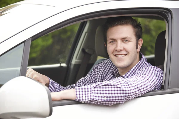 Portrait Of Young Male Driver Looking Out Of Car Window — Stock Photo, Image