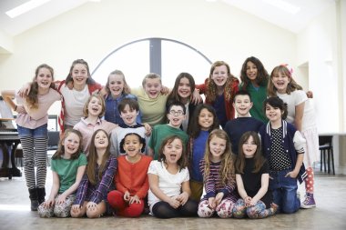 Large Group Of Children Enjoying Drama Workshop Together clipart