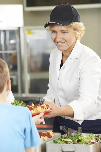 Pupil In School Cafeteria being Served Lunch By Dinner Lady — Stok Foto