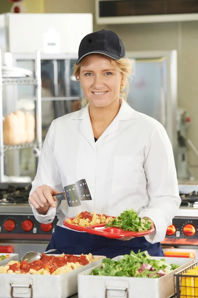 Portrait Of Dinner Lady Serving Meal In School Cafeteria — Stock Photo, Image