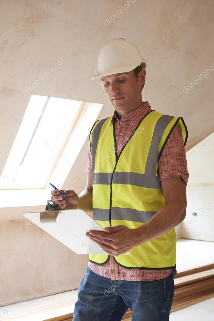 Building Inspector Looking At New Property