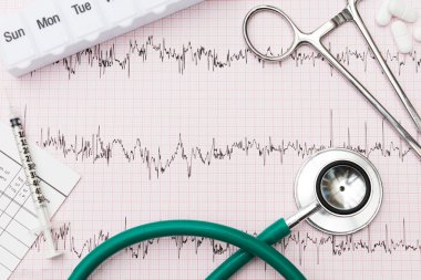Medical Equipment Arranged On Pulse Trace Printout