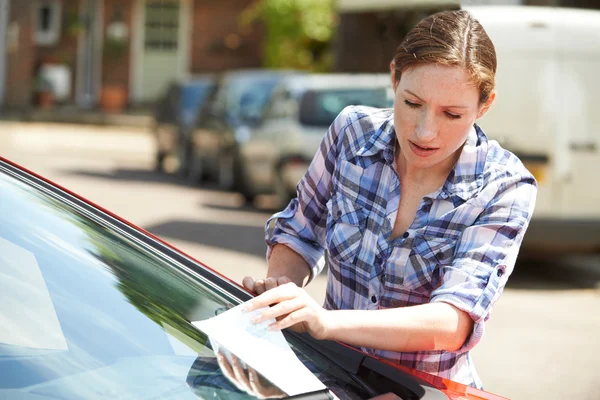 Frustrated Female Motorist Looking At Parking Ticket — Stok fotoğraf