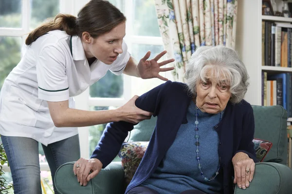 Care Worker Mistreating Senior Woman At Home — Stock Photo, Image