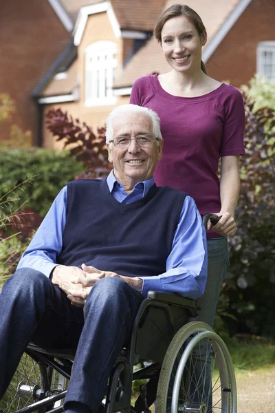 Adult Daughter Pushing Father In Wheelchair — Stock Photo, Image