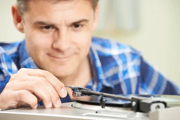 Mature Man Putting Vinyl Record On Player — Stock Photo, Image