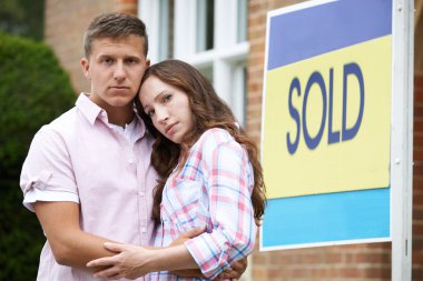 Young Couple Forced To Sell Home Through Financial Problems clipart