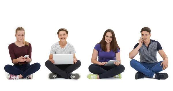 Studio Shot Of Teenagers Using Communication Technology — Stock Photo, Image