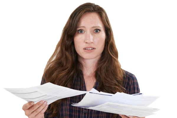 Studio Shot Of Worried Woman Looking At Bills — Stock Photo, Image