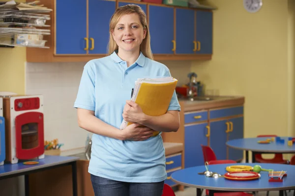 Childcare Worker Standing In Nursery — Stock Photo, Image