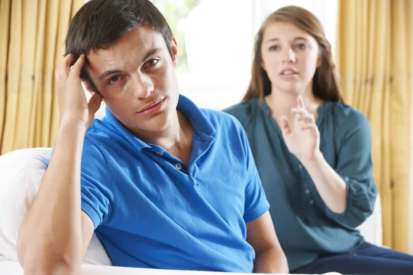 Teenage Couple Having Arguement At Home Stock Photo