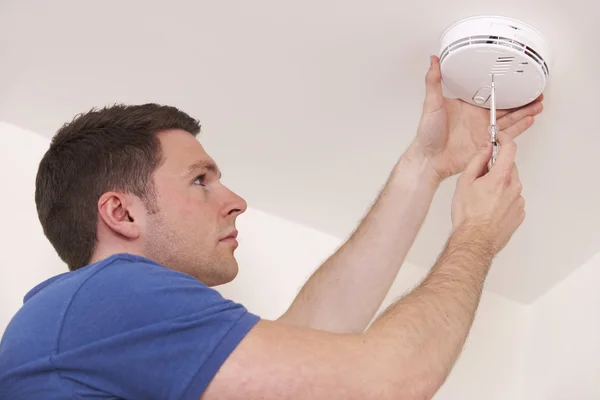 Man Installing Smoke Or Carbon Monoxide Detector — Stock Photo, Image