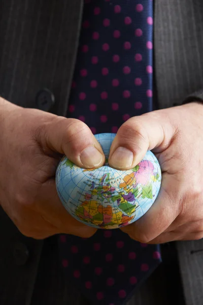 Businessman Squeezing Globe Over Europe And Africa — Stock Photo, Image