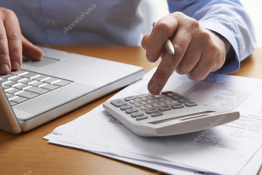 Man Working Out Household Finances